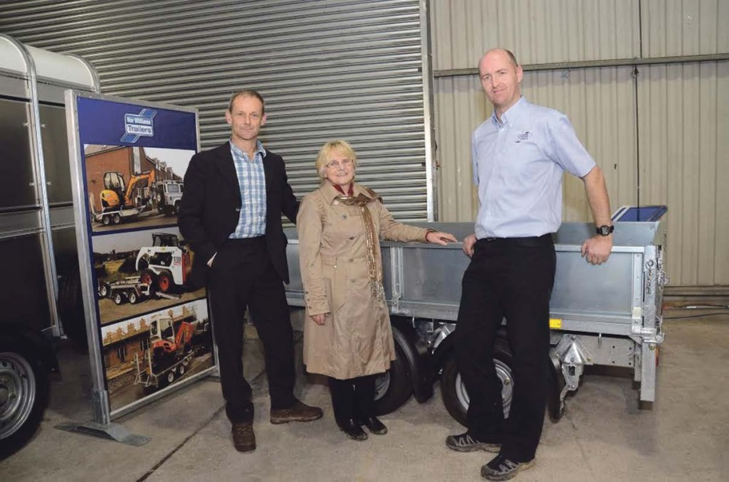 Winners: Ffermio presenter Alun Elidyr (left) with Mrs Thomas and Llion Roberts from Ifor Williams Trailers