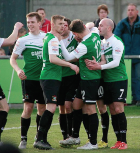 Celebration: The team congratulate Venables (Pic Chis Howells)