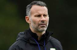 Wales manager Giggs charged with assault