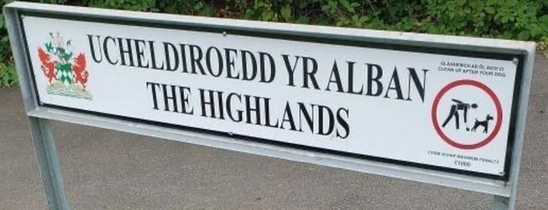 Welsh street sign places Scottish Highlands in Neath