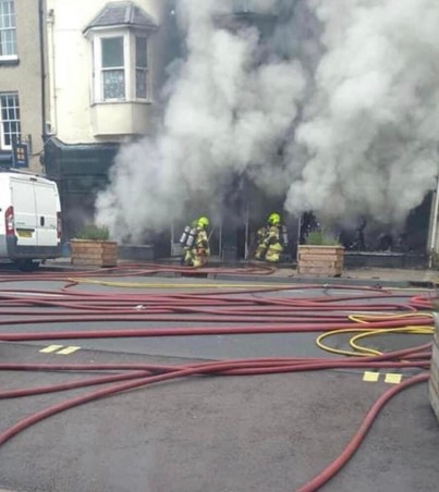 High street engulfed in smoke as fire breaks out at store